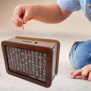 Wooden money box with engraved figures