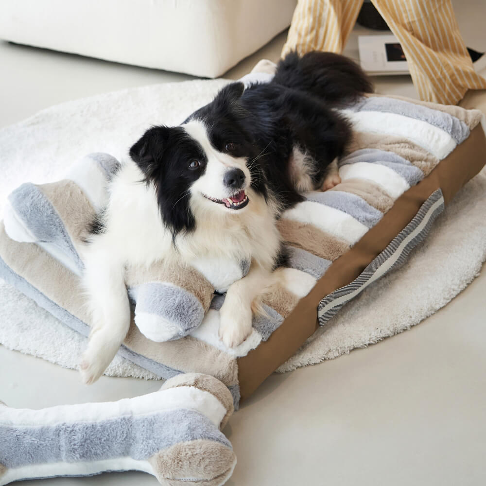 Cama relajante de felpa a rayas de lujo para perros con almohada